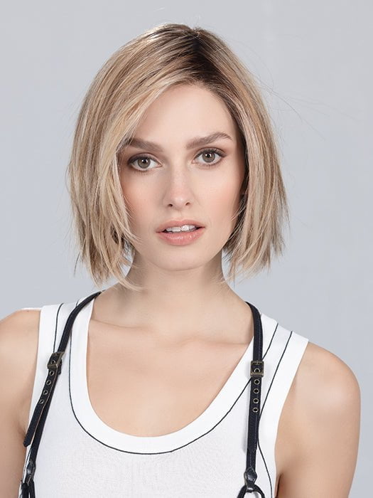 Model is wearing SAND MULTI ROOTED | Lightest Brown and Light Neutral Blonde with Light Reddish Auburn Blend and Shaded Roots