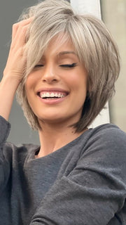 Roxie wearing REESE by NORIKO in SANDY SILVER | Medium Brown Transitionally Blending to Silver and Dramatic Silver Bangs