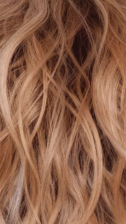 PEACHES AND CREAM | A vibrant peach blonde with creamy undertones and bright, face-framing cream highlights. Rich chocolate root adds depth.

