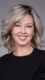 Model is wearing DONNA by BELLETRESS in color BUTTERBEER R | Dark Brown Base and Root that transitions smoothly into a buttery blonde, infused with creamy honey and toffee tones