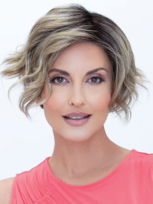 Model is wearing Donna by ENVY in GOLDEN SANDSTONE | Creamy Beige-Blonde with Darker Brown Roots