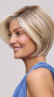 Model is wearing EVE by JON RENAU in color 101/88/27S8 CATALINA BLONDE | Pale blonde with Pure White Natural Violet halo highlights, shaded medium brown