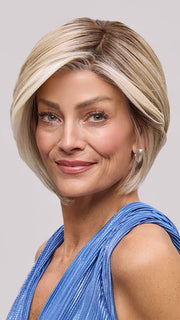 Model is wearing EVE by JON RENAU in color 101/88/27S8 CATALINA BLONDE | Pale blonde with Pure White Natural Violet halo highlights, shaded medium brown