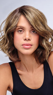 Model is wearing 10" AU NATUREL WAVES TOPPER in color SS9/24 ICED CAFÉ LATTE | Dark Brown shaded with Golden Brown