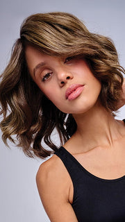 Model is wearing 10" AU NATUREL WAVES TOPPER in color SS9/24 ICED CAFÉ LATTE | Dark Brown shaded with Golden Brown