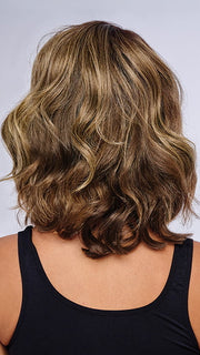 Model is wearing 10" AU NATUREL WAVES TOPPER in color SS9/24 ICED CAFÉ LATTE | Dark Brown shaded with Golden Brown