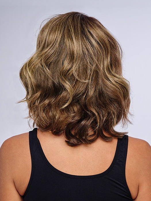 Model is wearing 10" AU NATUREL WAVES TOPPER in color SS9/24 ICED CAFÉ LATTE | Dark Brown shaded with Golden Brown