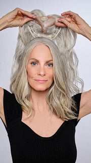 Model is wearing 16" AU NATUREL WAVES TOPPER by HAIRDO in color R56/60 SILVER MIST | Lightest Gray with 20% Medium Brown Evenly Blended with Pure White