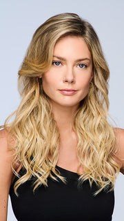 Model is wearing 18" VOLUME EXTENSION by HAIRDO in color SS14/88H SHADED GOLDEN WHEAT | Dark Blonde Evenly Blended with Pale Blonde Highlights and Dark Roots