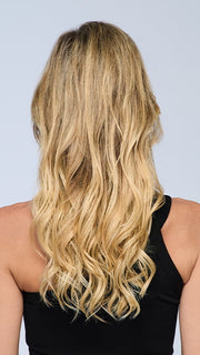 Model is wearing 18" VOLUME EXTENSION by HAIRDO in color SS14/88H SHADED GOLDEN WHEAT | Dark Blonde Evenly Blended with Pale Blonde Highlights and Dark Roots