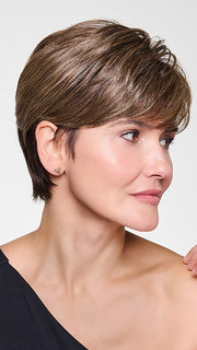 Model is wearing CROP CUT TOPPER by HAIRDO in color SS9/24 ICED CAFÉ LATTE | Dark Brown shaded with Golden Brown