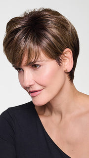 Model is wearing CROP CUT TOPPER by HAIRDO in color SS9/24 ICED CAFÉ LATTE | Dark Brown shaded with Golden Brown
