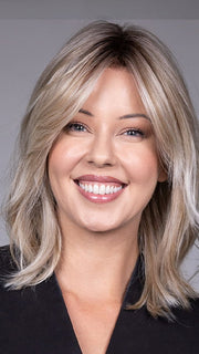 Model is wearing MONACO by BELLETRESS in color MILKSHAKE BLONDE R | A mixture of Light Sandy Brown, Highlighted with Light Ash Blonde with a Hint of Light Platinum Blonde with a Medium Root Color