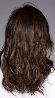 Model is wearing MUNICH by BELLETRESS in color MOCHA MAPLE BROWN | A mix of Dark Brown, Medium Brown, Light Auburn, Medium Strawberry