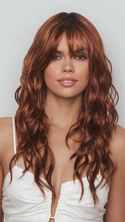 Model is wearing PHILLIPA by RENE OF PARIS in color CAFE ROUGE R | A dimensional auburn copper blend with rich reddish-brown roots melting into warm copper highlights