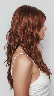 Model is wearing PHILLIPA by RENE OF PARIS in color CAFE ROUGE R | A dimensional auburn copper blend with rich reddish-brown roots melting into warm copper highlights