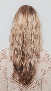 Model is wearing PHILLIPA by RENE OF PARIS in color WINTER OAT LATTE R | rooted honey blonde and platinum blonde blend with soft, dimensional highlights and lowlights