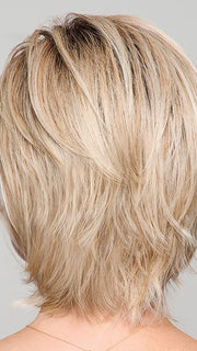 Model is wearing BOUTIQUE CHIC by RAQUEL WELCH in RL19/23SS SHADED BISCUIT | Light Ash Blonde Evenly Blended with Cool Platinum Blonde with Dark Roots