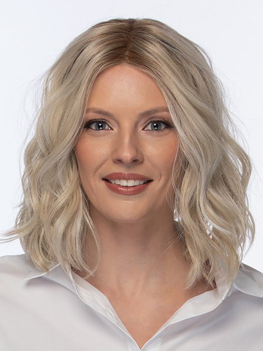 Model is wearing SOMERS by ESTETICA in color SUNLITBLONDE | Soft Blend of Sandy Blonde, Lightest Blonde & Iced Blonde with a Light Golden Brown Roots