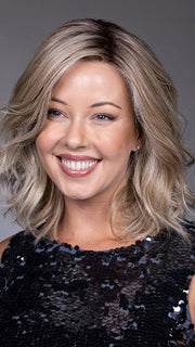 Model is wearing VIVIENNE by BELLETRESS in color BUTTERBEER R | Dark Brown Base and Root that transitions smoothly into a buttery blonde, infused with creamy honey and toffee tones