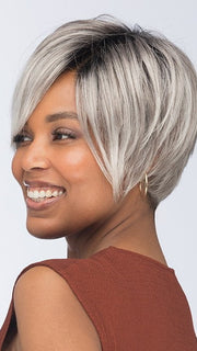 Model is wearing VESPER by ESTETICA in color CHROMERT1B | Gray & White with 25% Medium Brown Blend & Off-Black Roots