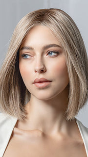 Model is wearing Supreme Plus Deluxe by Ellen Wille in color SAND MULTI ROOTED 15.22.14 | Light Ash Blonde and Light Neutral Blonde with Medium Ash Blonde Blend and Shaded Roots