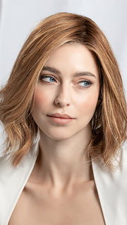 Model is wearing Supreme Plus Deluxe in color TOBACCO ROOTED 12.26.27 | Medium Brown Blended with Light Auburn, Lightest Brown, and Dark Strawberry Blonde Blend with Shaded Roots
