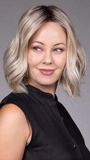 Model is wearing AMI in color BUTTER BEER R | A rich blend of warm brunette and golden honey highlights finished with a soft, natural root.