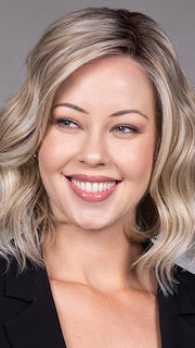 Model is wearing VERONICA in Butter Beer R | Dark Brown Base and Root that transitions smoothly into a buttery blonde, infused with creamy honey and toffee tones
