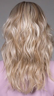 Model is wearing MARIE in BUTTERBEER R | Dark Brown Base and Root that transitions smoothly into a buttery blonde, infused with creamy honey and toffee tones