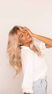 Sophia is wearing LYNDON by RENE OF PARIS in color MELTED-MARSHMALLOW | Subtly Warm Dark Sandy Blonde Blend with Medium Brown Roots and Light Ash Blonde Tips and Highlights