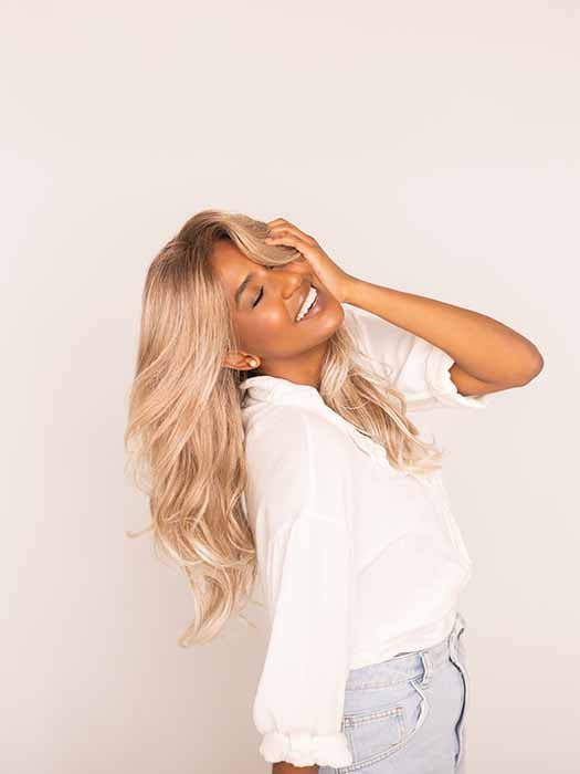 Sophia is wearing LYNDON by RENE OF PARIS in color MELTED-MARSHMALLOW | Subtly Warm Dark Sandy Blonde Blend with Medium Brown Roots and Light Ash Blonde Tips and Highlights