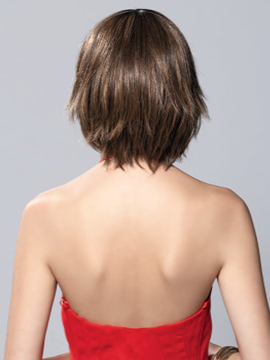 Model is wearing TESS MONO PART by ELLEN WILLE in color NOUGAT ROOTED | Lightest Brown and Medium Brown with Light Strawberry Blonde Blend with Shaded Roots