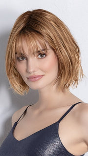 Model is wearing DARK SAND FROSTED | Lightest Brown and Medium Warm Brown with Grey Blend and a Soft Matte Finish
