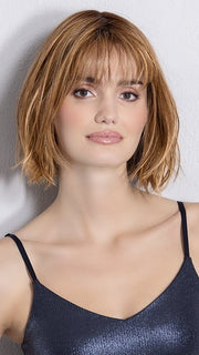 Model is wearing DARK SAND FROSTED | Lightest Brown and Medium Warm Brown with Grey Blend and a Soft Matte Finish
