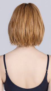 Model is wearing DARK SAND FROSTED | Lightest Brown and Medium Warm Brown with Grey Blend and a Soft Matte Finish
