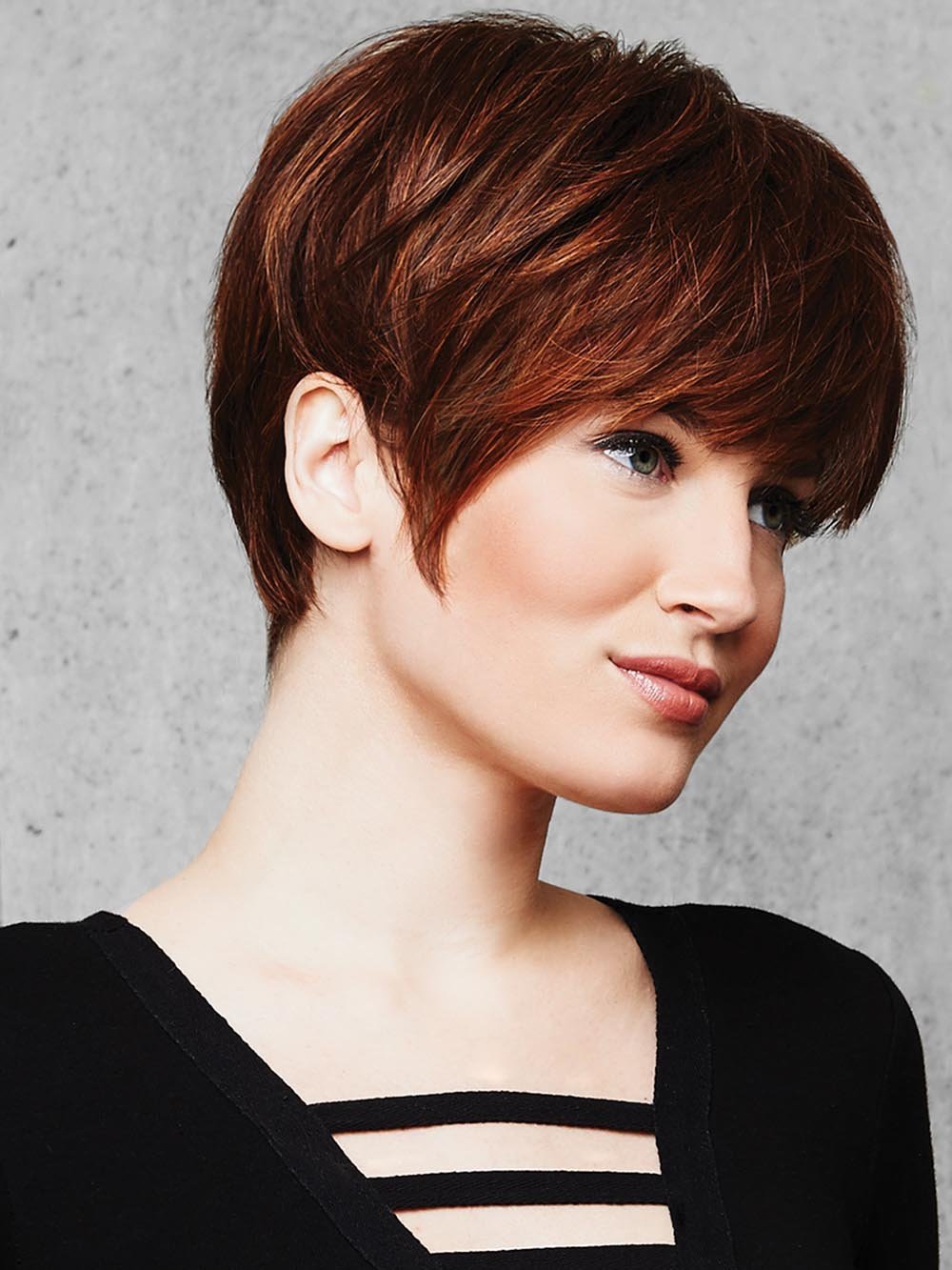 A classic “boy cut”, the SHORT TEXTURED PIXIE CUT Wig by Hairdo features textured bangs and all over precision tapered layers that blend into a neck-hugging nape