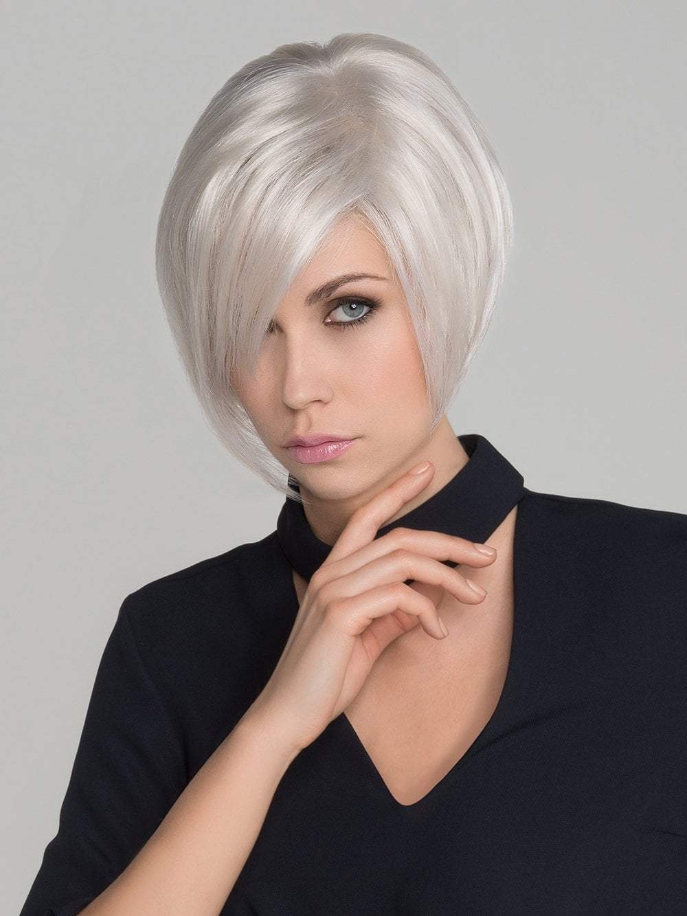 A lightweight asymmetrical lace front wig with a long fringe that falls perfectly along the face