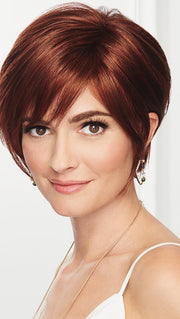 A side-swept bang, face-framing layers with tapered edges