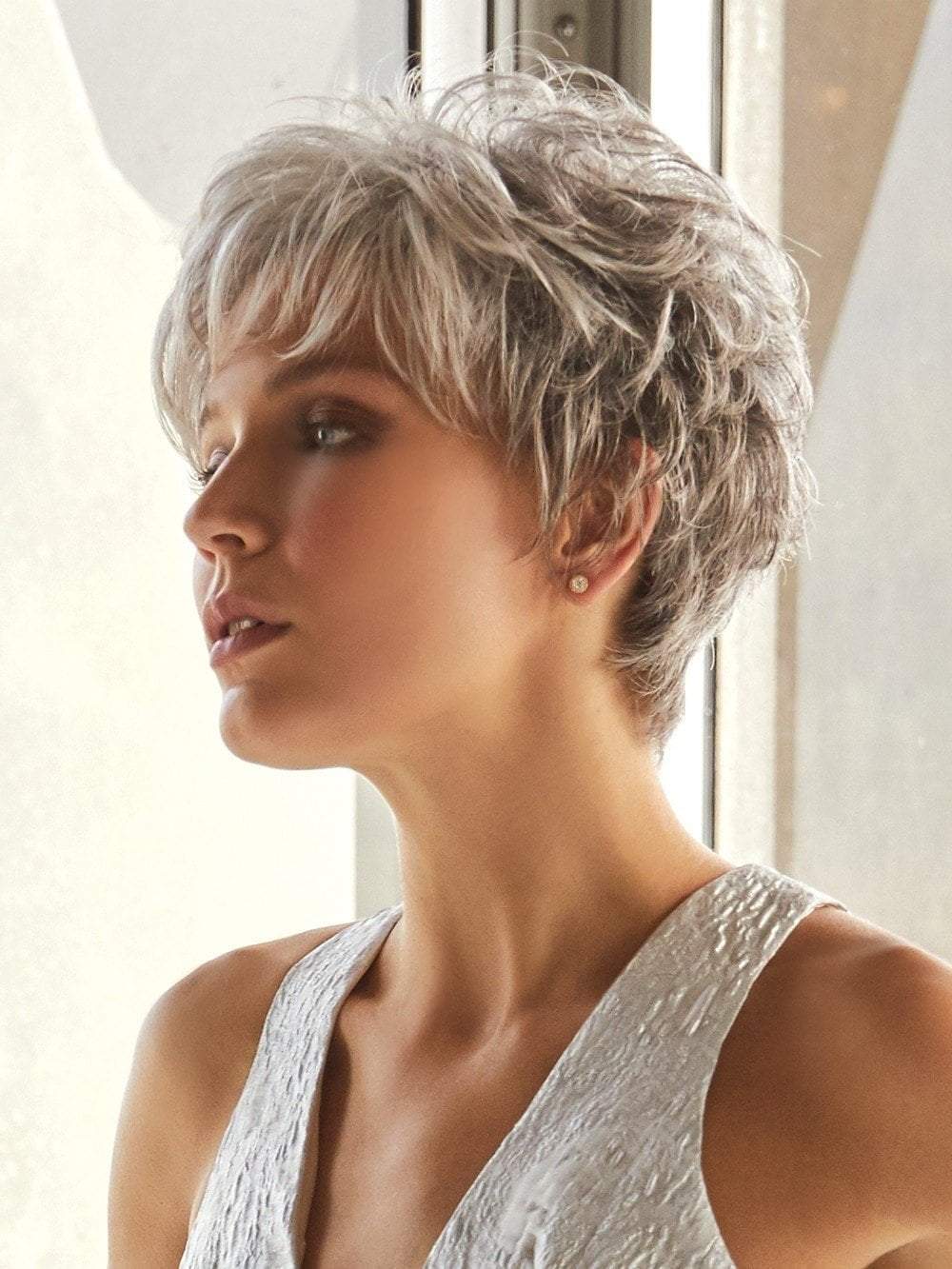 This soft layered short pixie can be brushed over the top to create a touch of height.