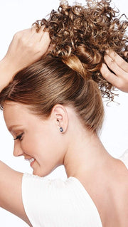 Pull your hair up in a bun, pull the drawstring tight for secure attachment