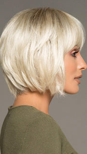 Full fringe falls right above the brow bone and is textured perfectly, creating a feathered look