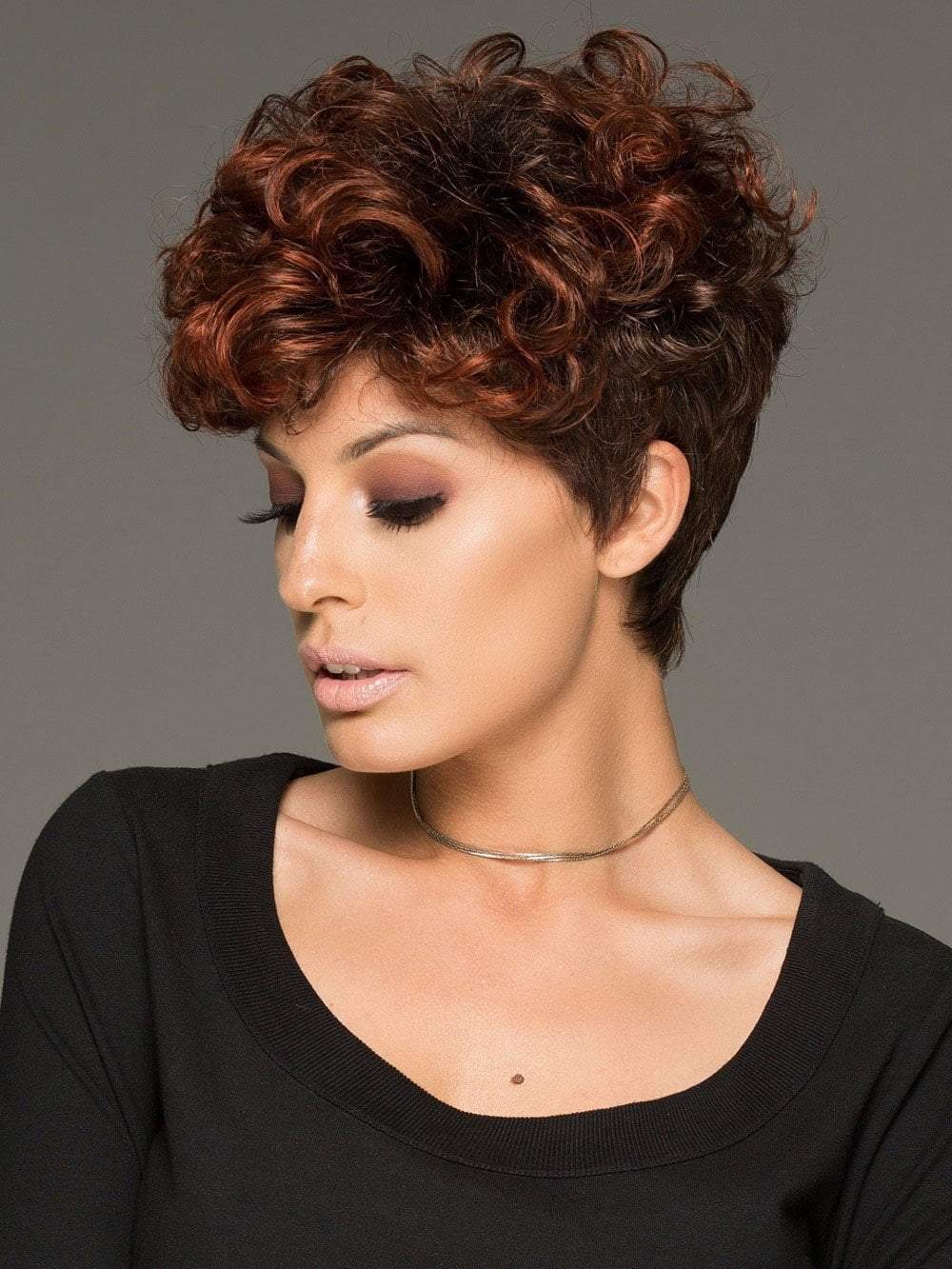 The side bang can be cut or trimmed by your stylist. The layered curl provides full coverage along the hairline