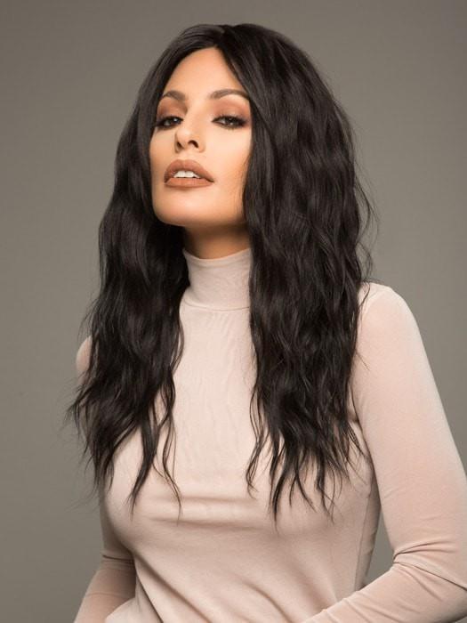 A wavy wig with long layers and a center part