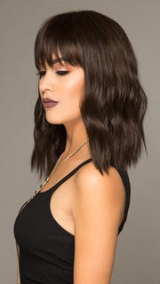 A mid-length cut with full bangs and the perfect wave!