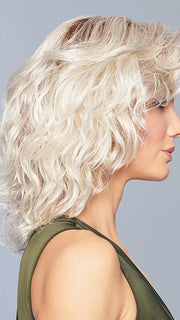A collar length, all over layered shape with tons of spiral waved curls