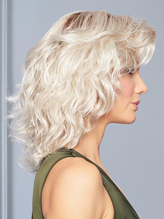 A collar length, all over layered shape with tons of spiral waved curls