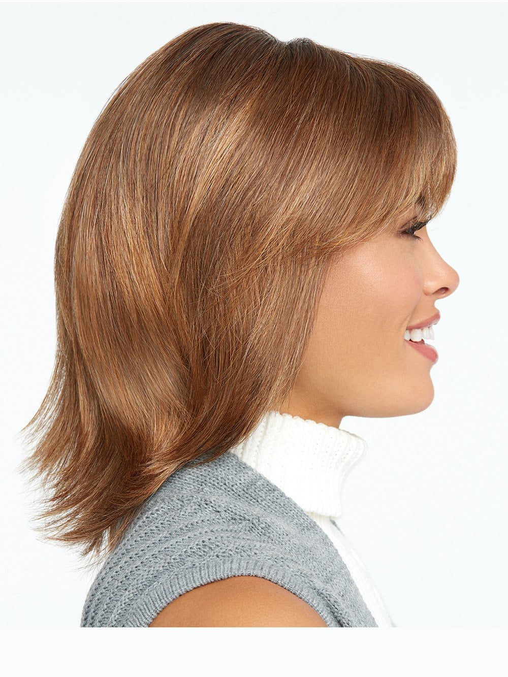 Featuring razor tapered bangs that blend into long razor-cut layers in the sides and back