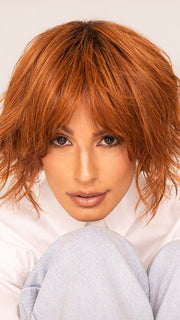 Roxie wearing JOSS by RENE OF PARIS in SHADED-AMBER | Coppery Blonde and Red Blend with Dark Amber Brown Roots