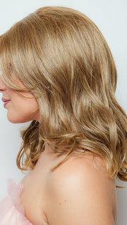 A medium length wig with a stunning curl pattern